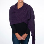 Picture of dark purple knit shoulder wrap that is chemo port accessible and picc line accessible
